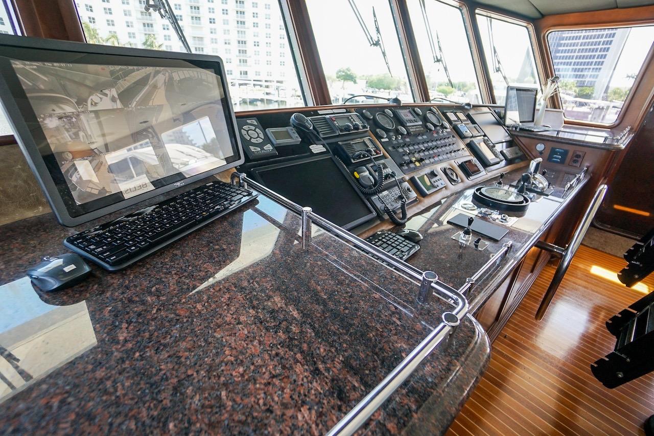 Control room of 1996 ABD 90 Explorer yacht with navigation equipment and monitors.