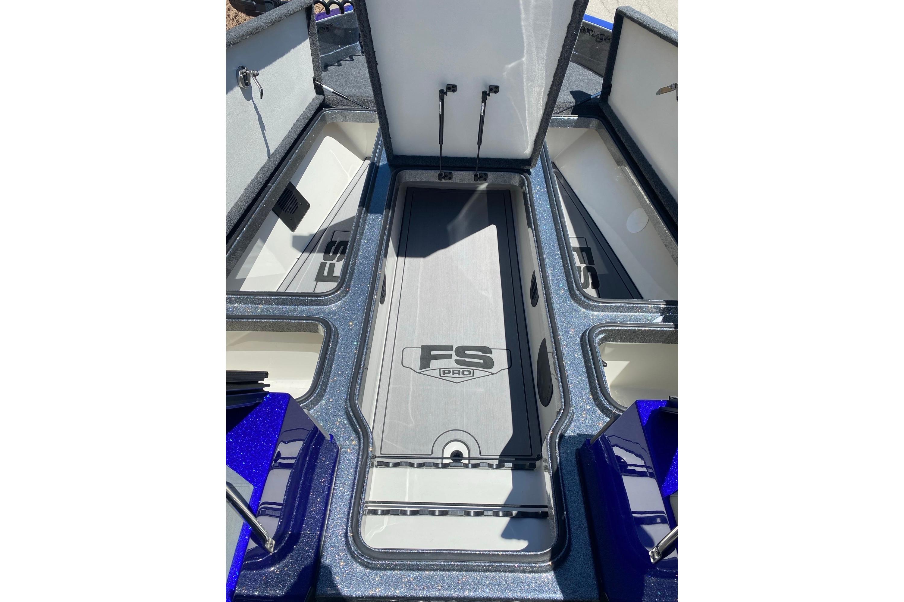 2026 Ranger 622FS Pro boat storage compartments with open lids, showcasing spacious interior design.