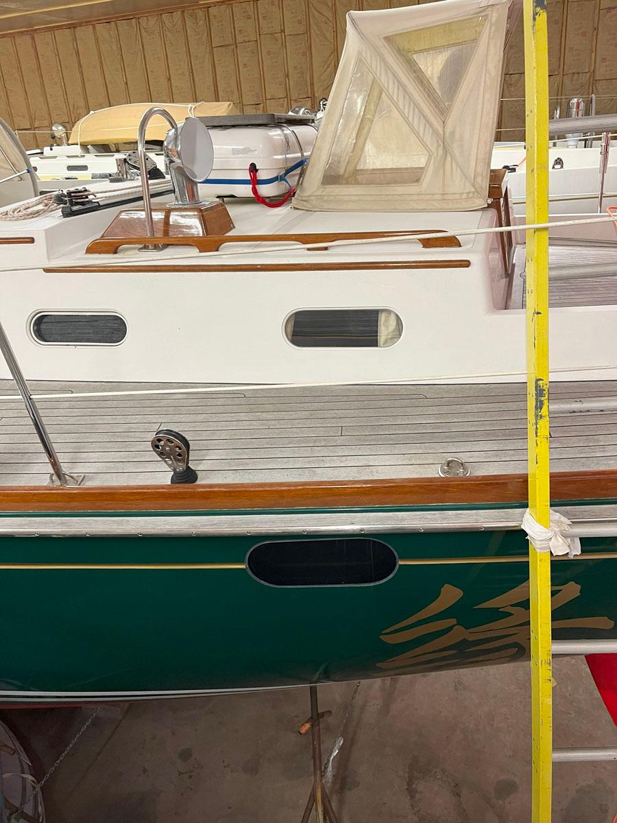 2001 Hinckley Sou'wester 59 CC sailboat with green hull and wooden deck details.