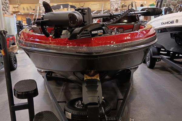2025 Ranger 1880MS boat with Minn Kota motor, displayed indoors.