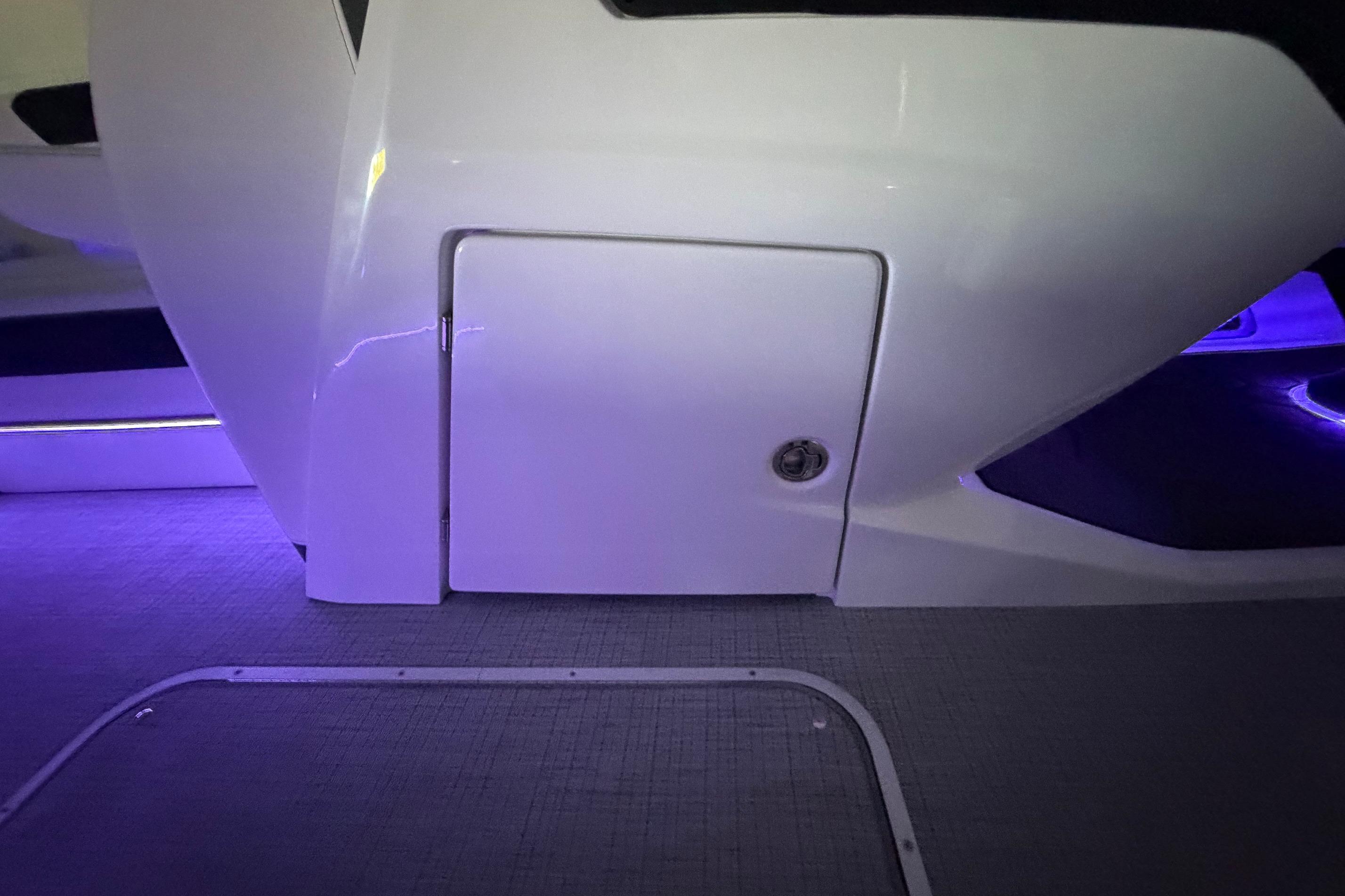 Interior view of 2026 South Bay 525SB2 boat with ambient purple lighting.