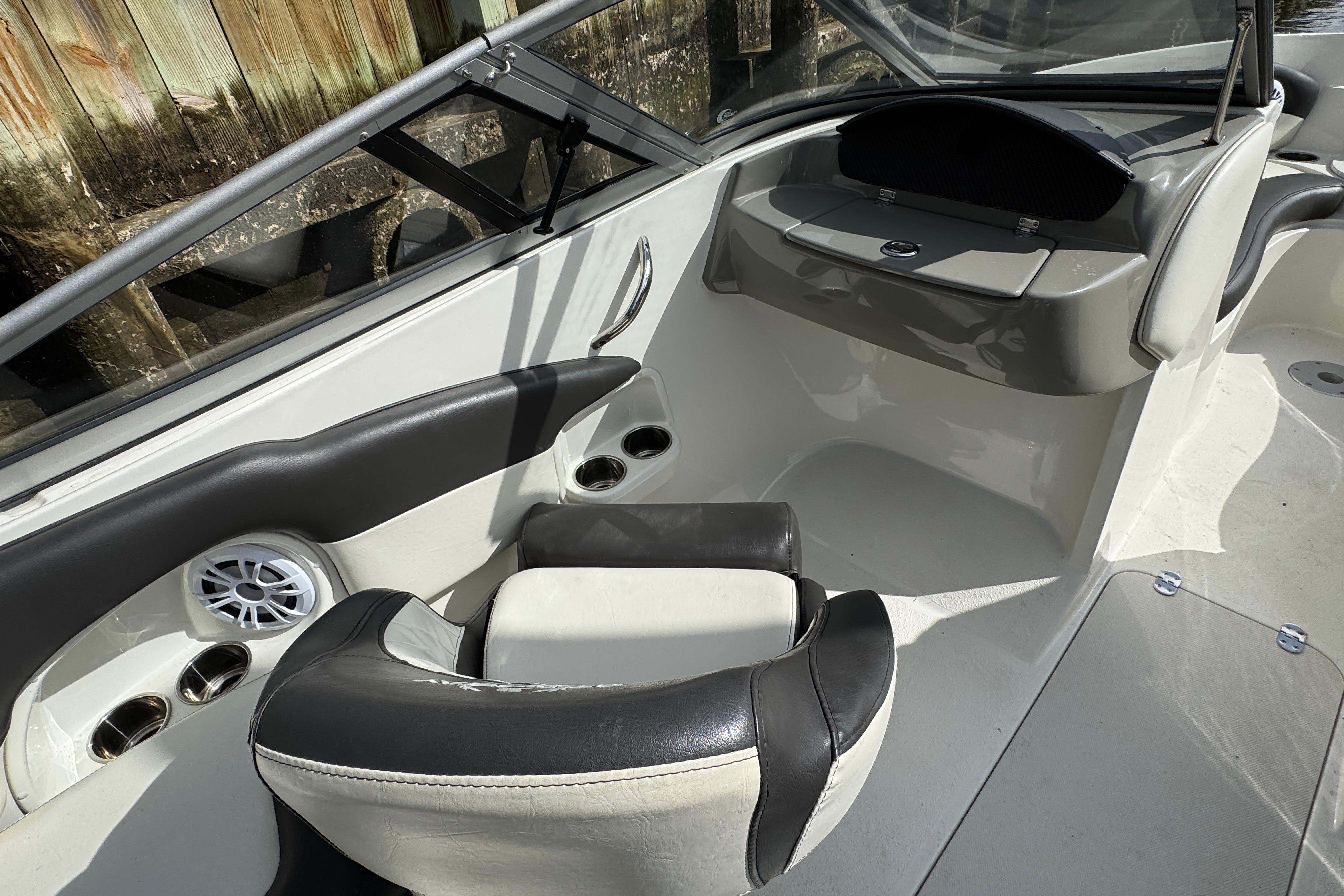 Interior of a 2019 Stingray 204 LR boat, featuring seating and cup holders.