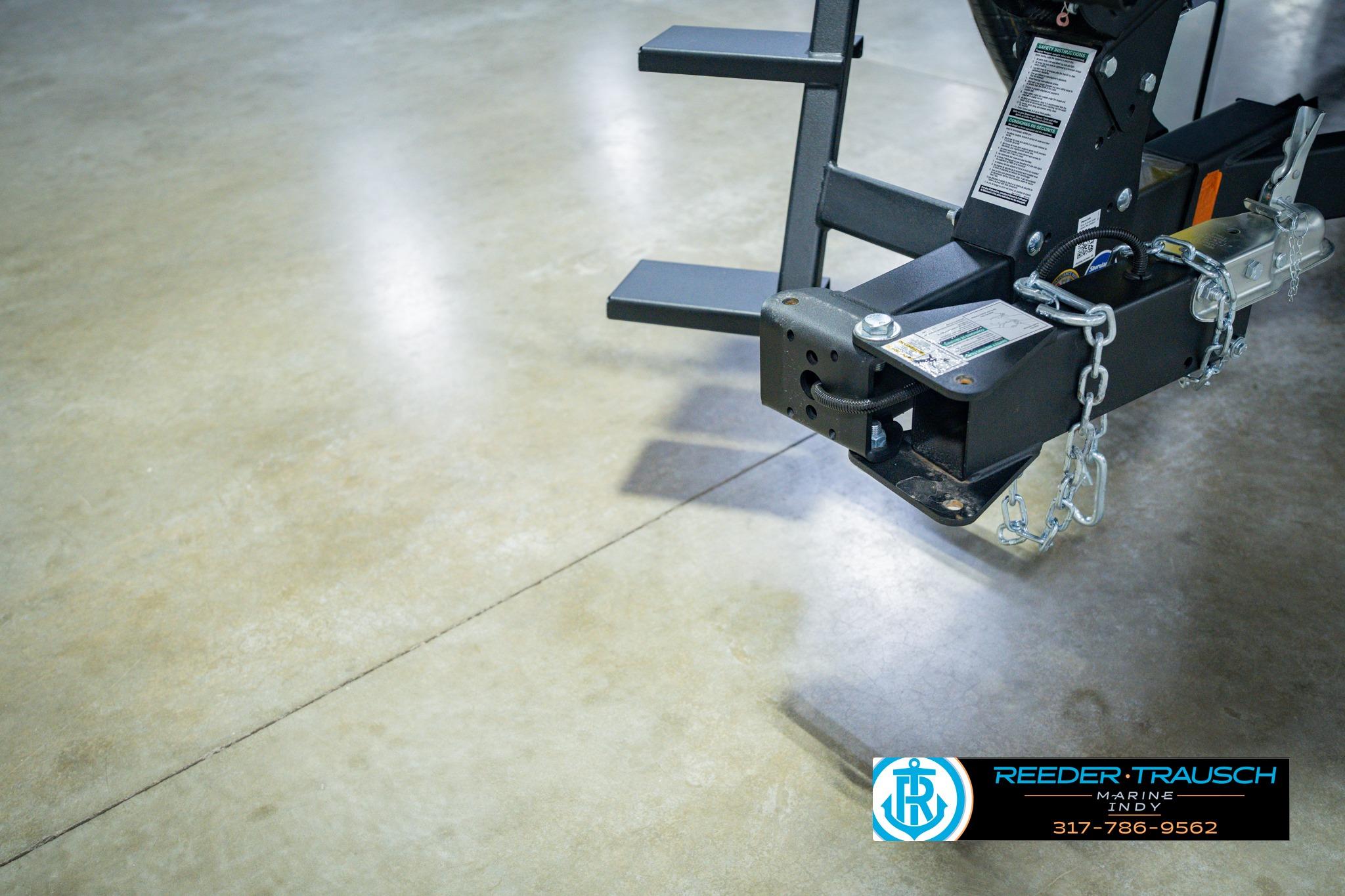 Trailer hitch of 2026 Lund 1775 Impact XS on polished concrete floor.