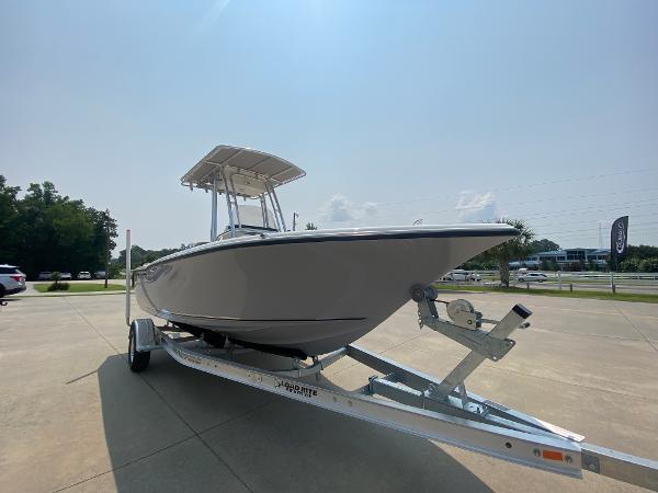 2024 Key West 203 FS boat on a trailer in a parking lot.