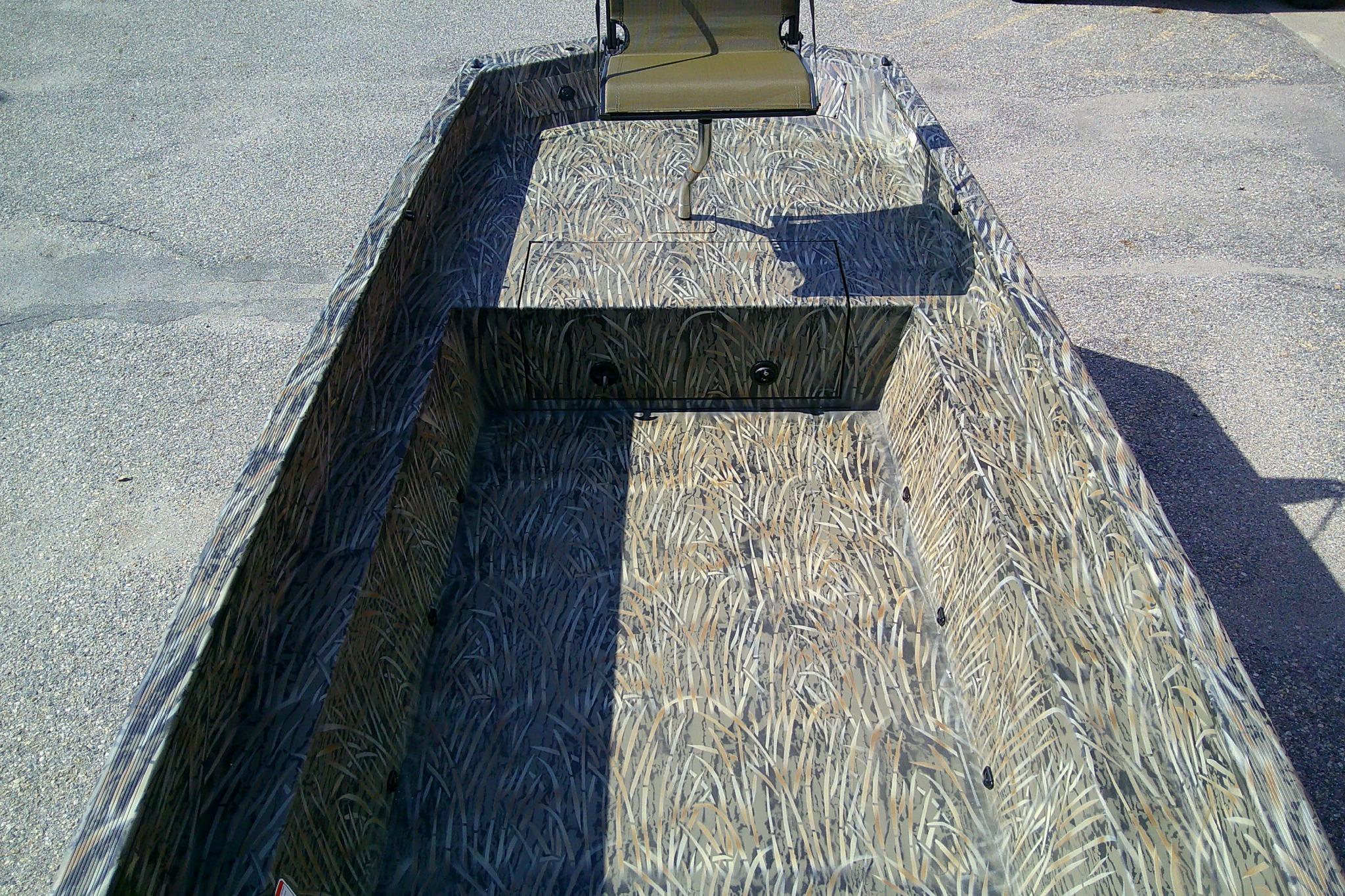 2026 Tracker Grizzly 1650 T Prairie Wings Edition boat with camouflage interior design.