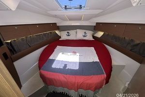 Interior of Jeanneau NC 895 yacht, cozy bedroom.
