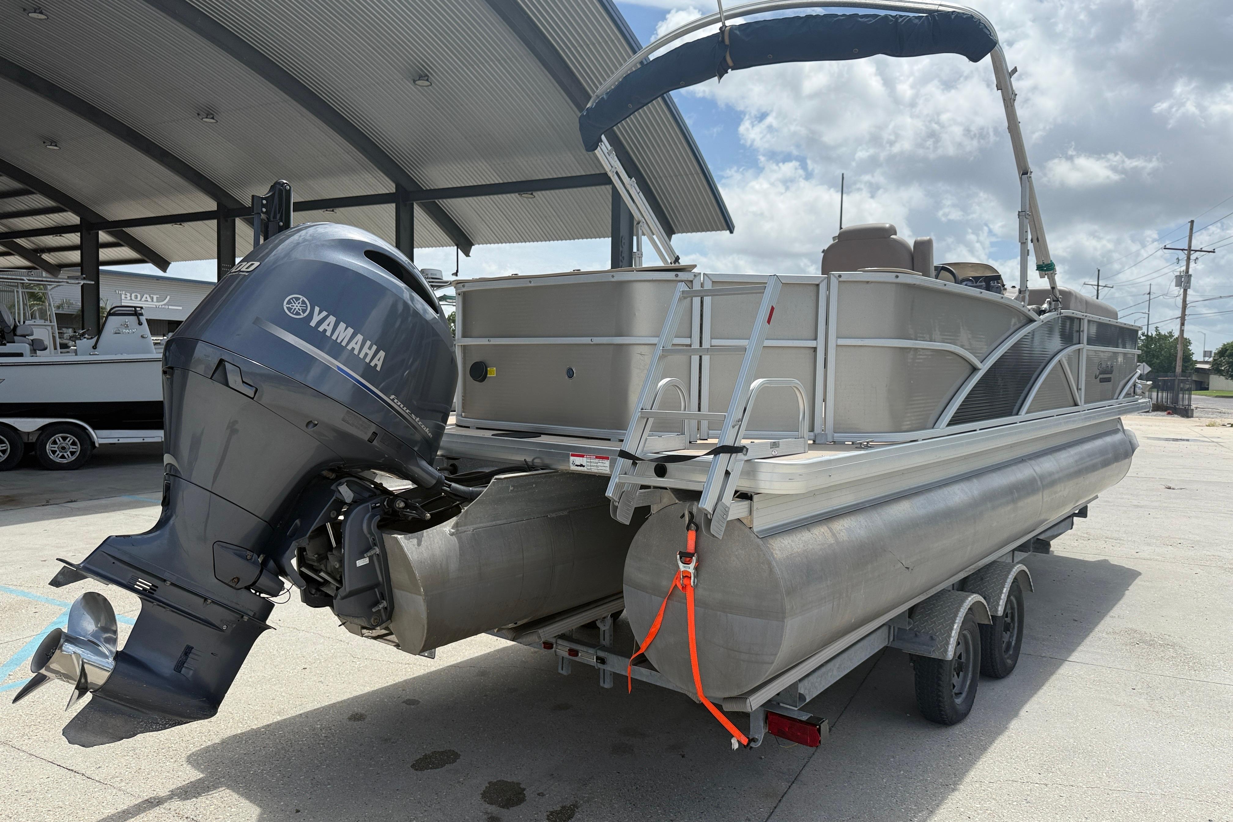 2014 Godfrey Sweetwater 2486 C pontoon boat with Yamaha outboard motor on trailer.
