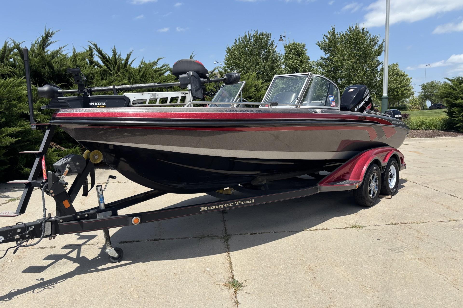 2011 Ranger 620 VS fishing boat on trailer, parked outdoors.