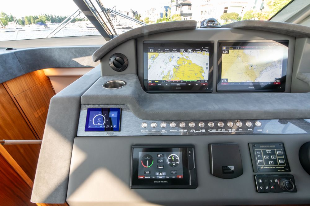 2022 Riviera 6000 Sport Yacht Platinum dashboard with navigation screens and controls.