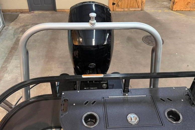 2026 Ranger 220F boat motor and deck in a garage setting.