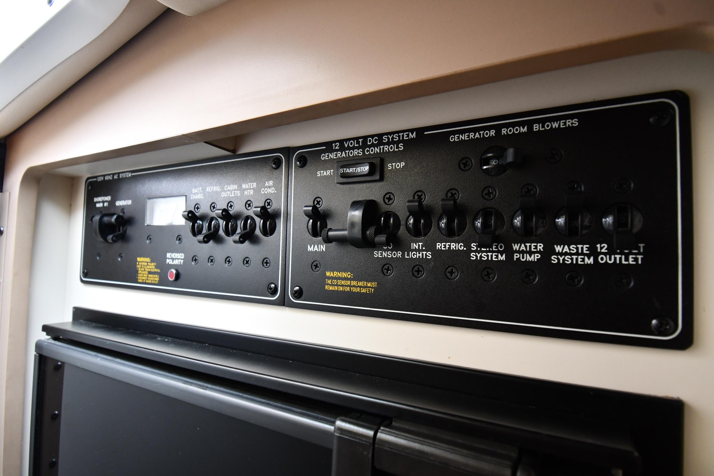 Control panel of a 2004 Formula 330 Sun Sport boat, featuring various system switches.