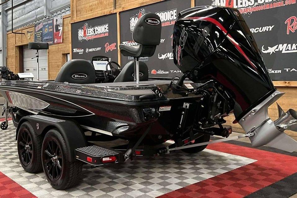 2026 Triton 20XP Patriot boat displayed indoors on checkered flooring.