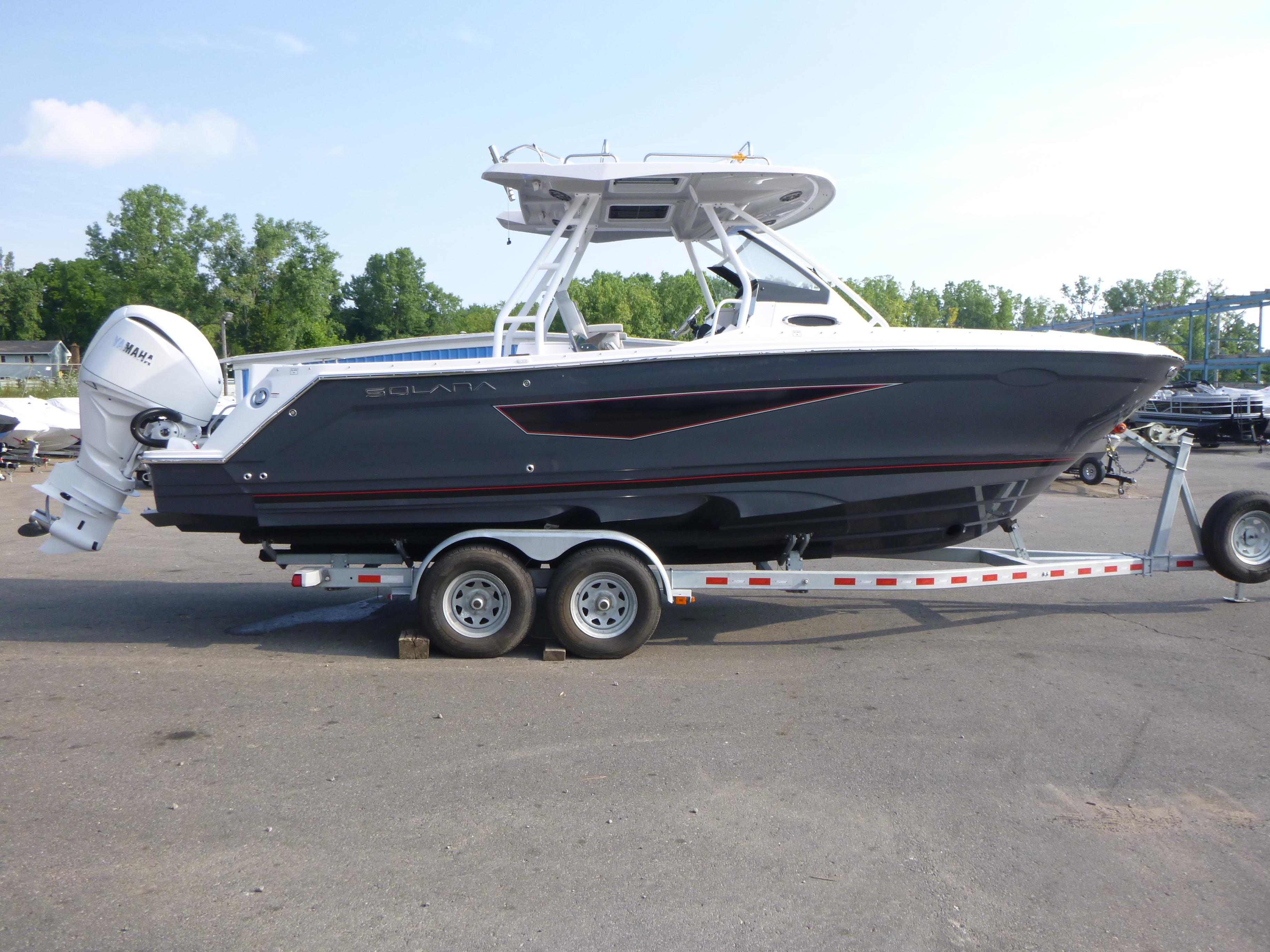 2025 Solara S-250 CW boat on trailer, parked outdoors.