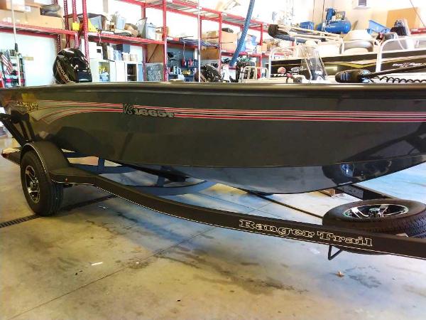 2024 Ranger VS1665T fishing boat on trailer in a garage setting.