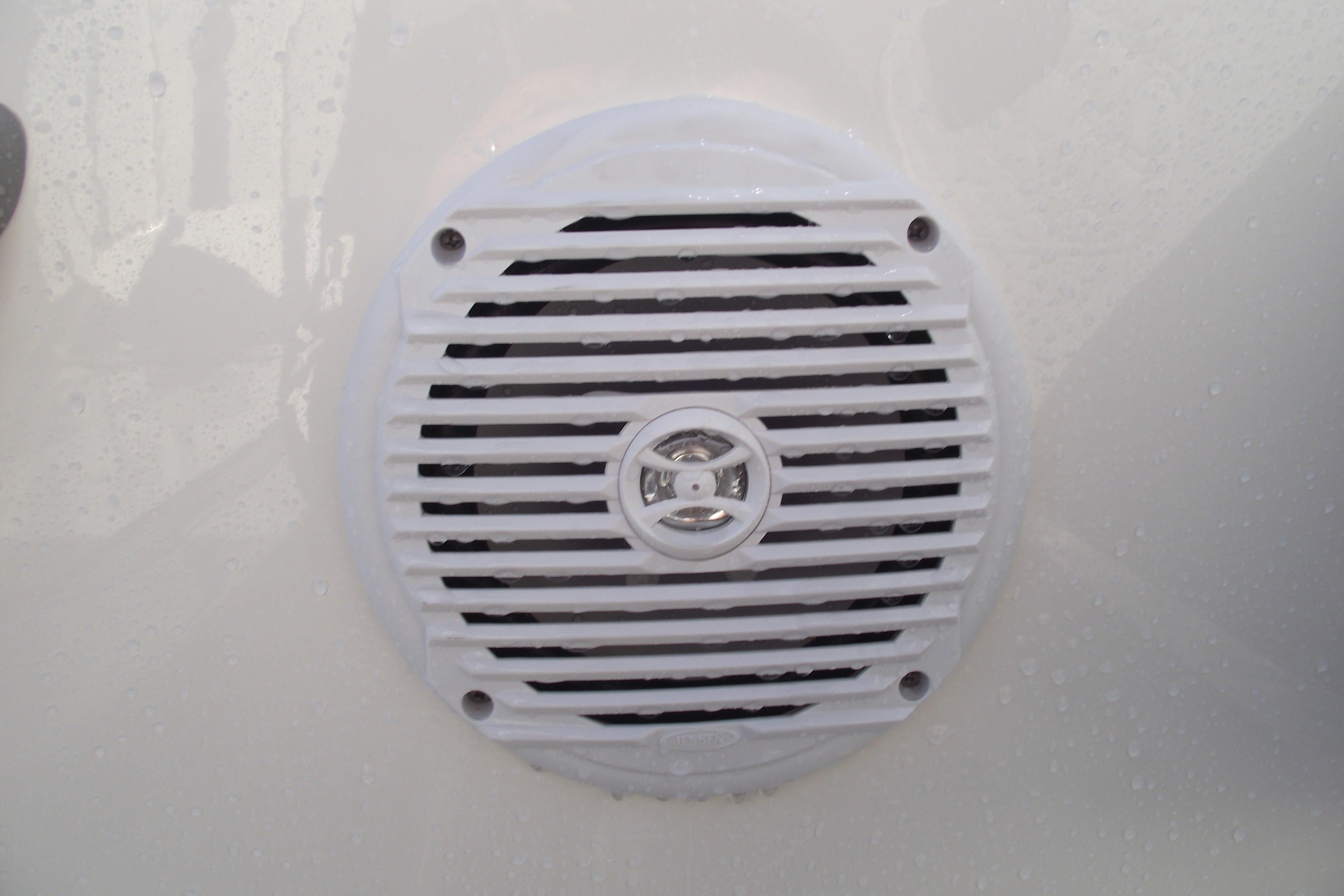 White speaker on 2026 Bayliner M19 boat, featuring a circular grille design.