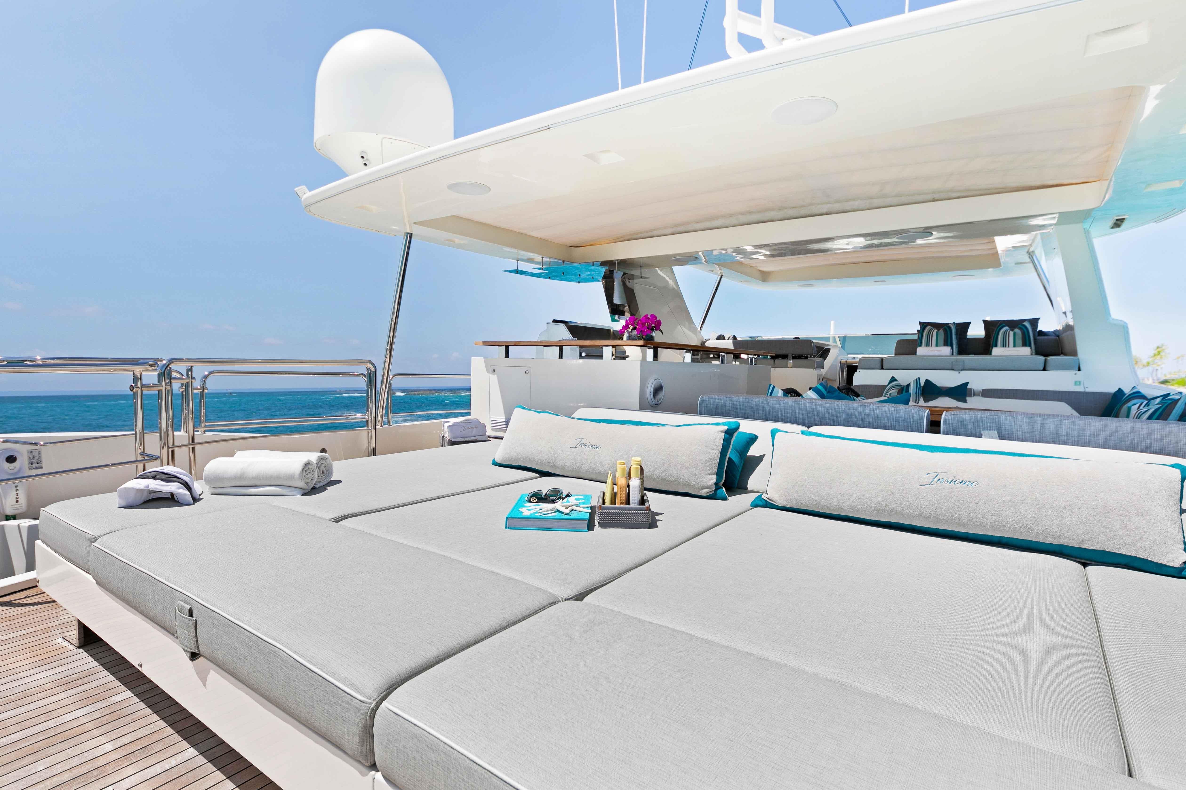 Luxurious Azimut Grande 32M yacht deck with sun loungers and ocean view, 2012 model.
