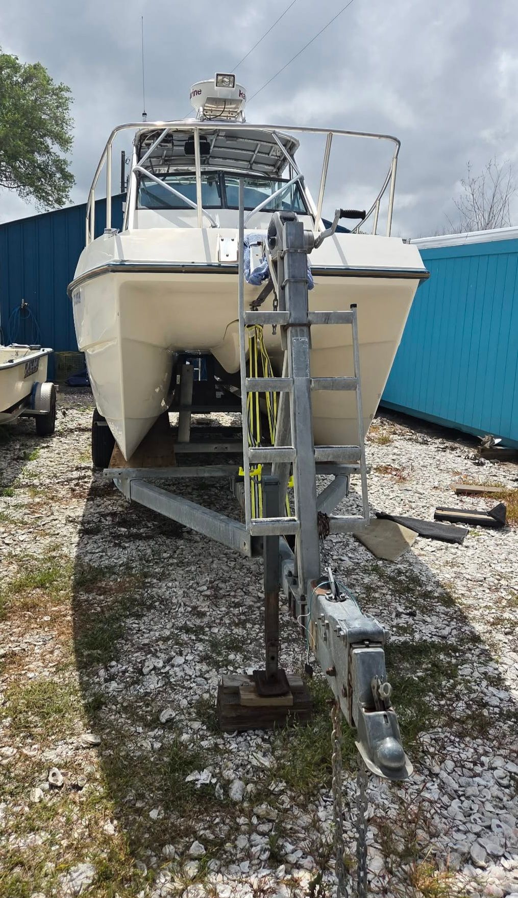 1997 Sea Cat SLC 5 boat on trailer, side view.