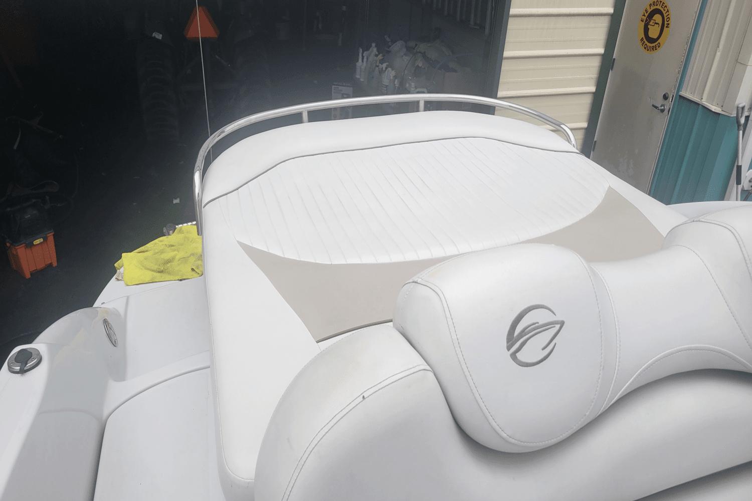 2012 Crownline 265 SS boat with white leather seating in a storage area.