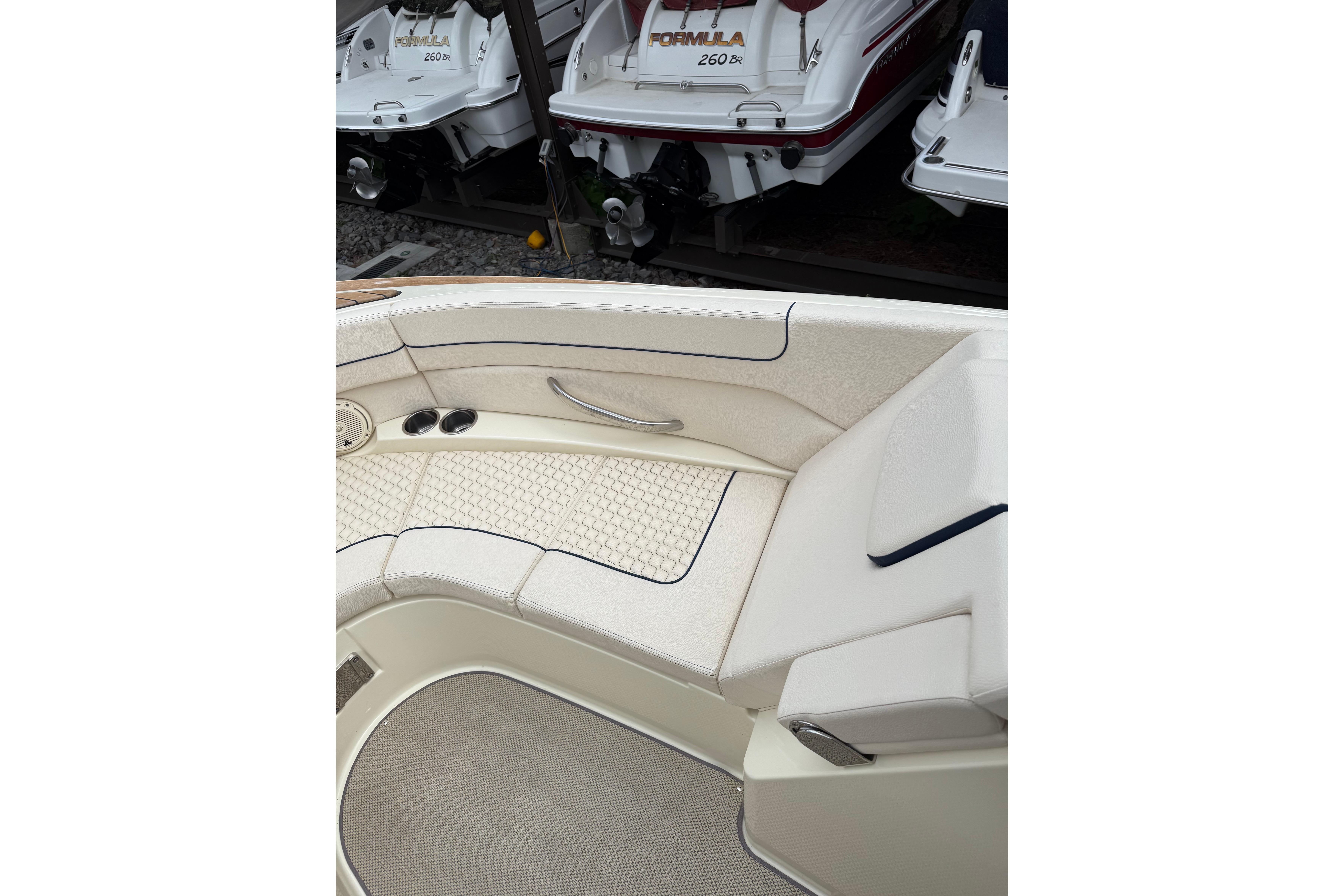 2019 Chris-Craft Launch 28 GT boat interior with white seating and elegant design.