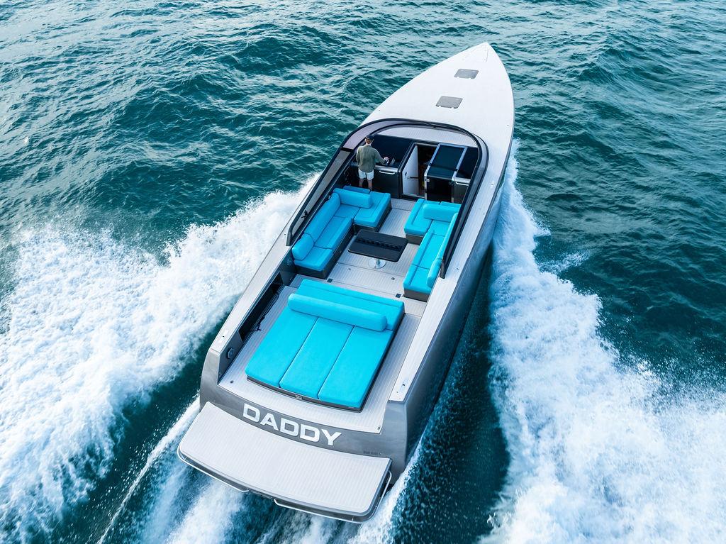 Luxurious 2015 VanDutch 55 yacht cruising on open water with sleek design and vibrant seating.
