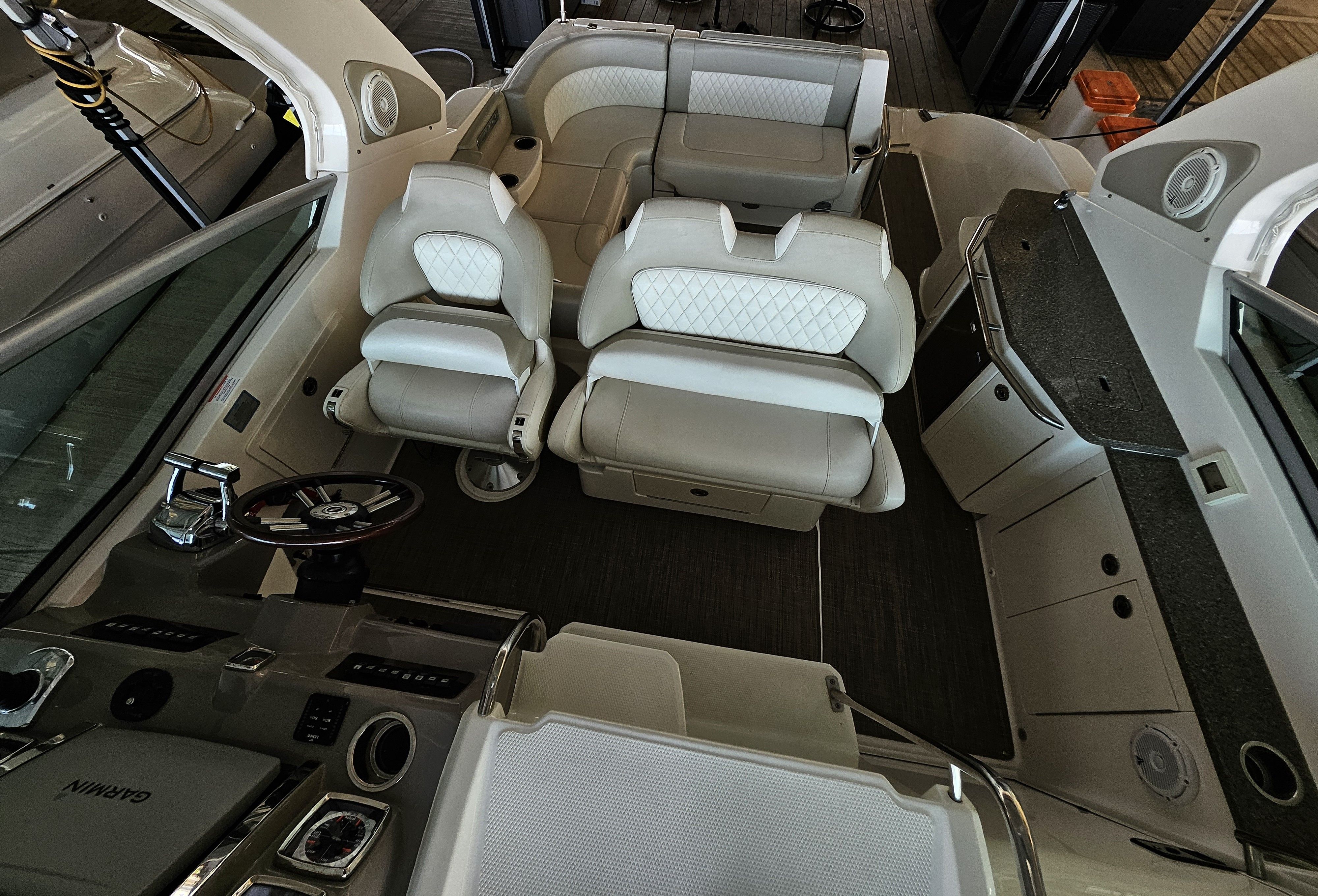 Interior of a 2014 Chaparral 330 Signature boat with luxurious seating.