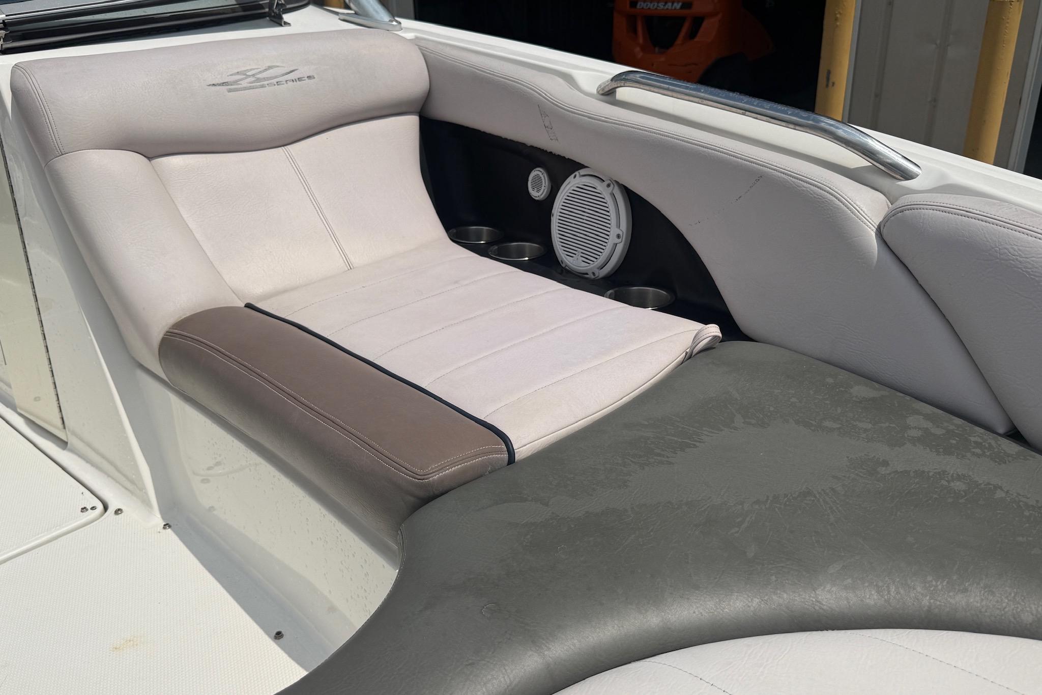 2006 MasterCraft X45 boat interior with cushioned seating and built-in speakers.