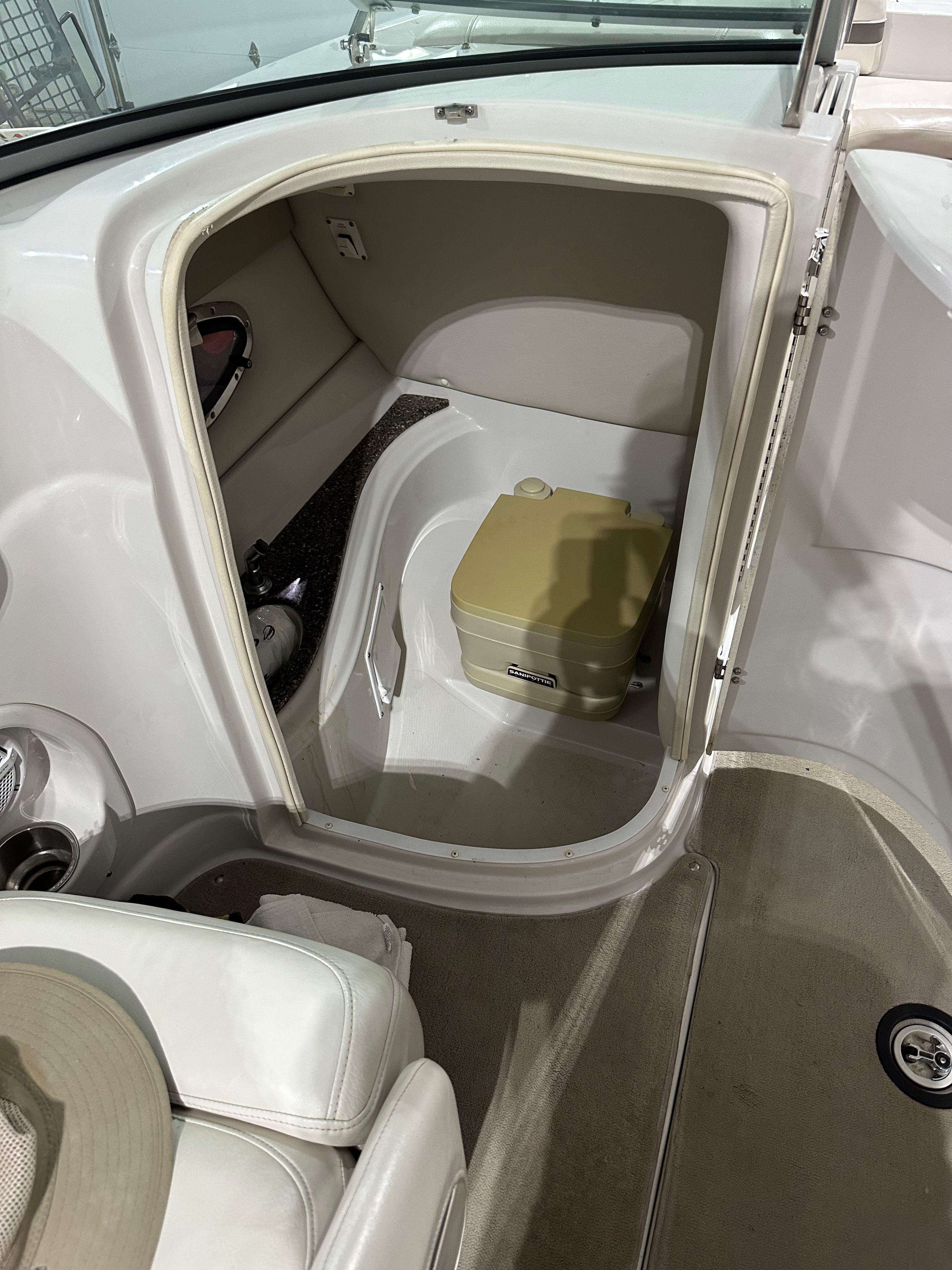 Interior of a 2007 Crownline 252 EX featuring a small toilet.