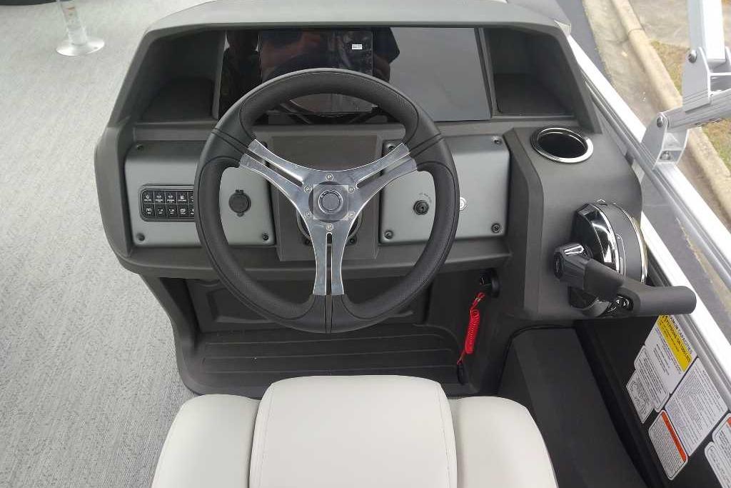 Steering console of 2026 Sun Tracker Fishin' Barge 22 DLX pontoon boat.