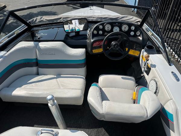 1992 Correct Craft Ski Nautique boat interior with steering wheel and seating.