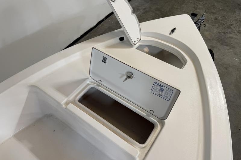 2026 Sea Pro 172 Bay boat storage compartment with open hatch, showcasing interior space.