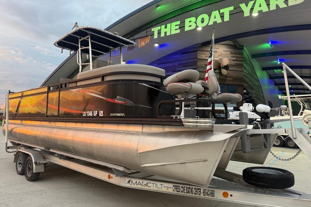 2022 Apex Marine 8524 Pro Fish N Cruise pontoon boat on trailer at dealership.