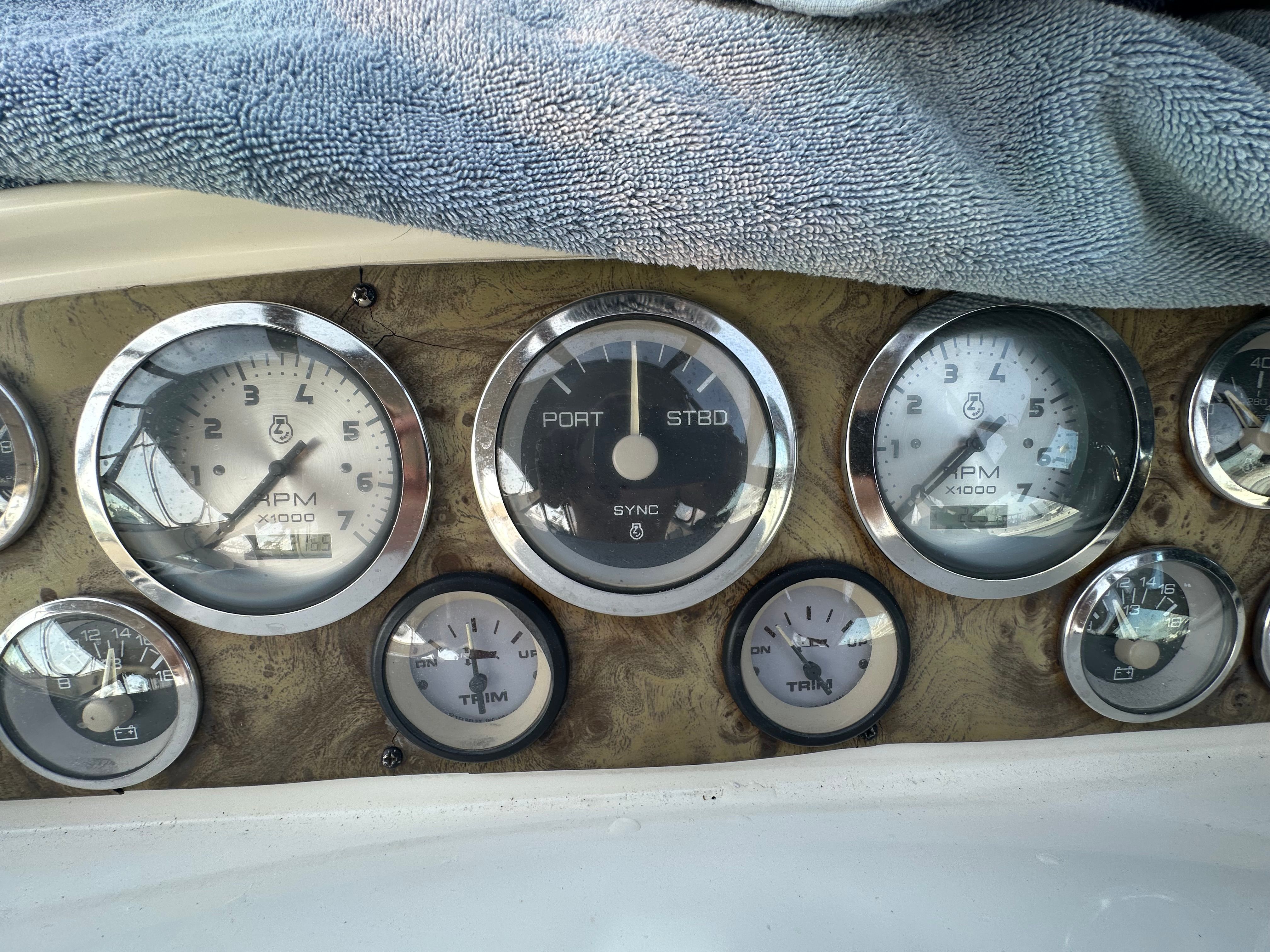 Dashboard of a 1999 Wellcraft 3000 Matrinique boat with gauges.
