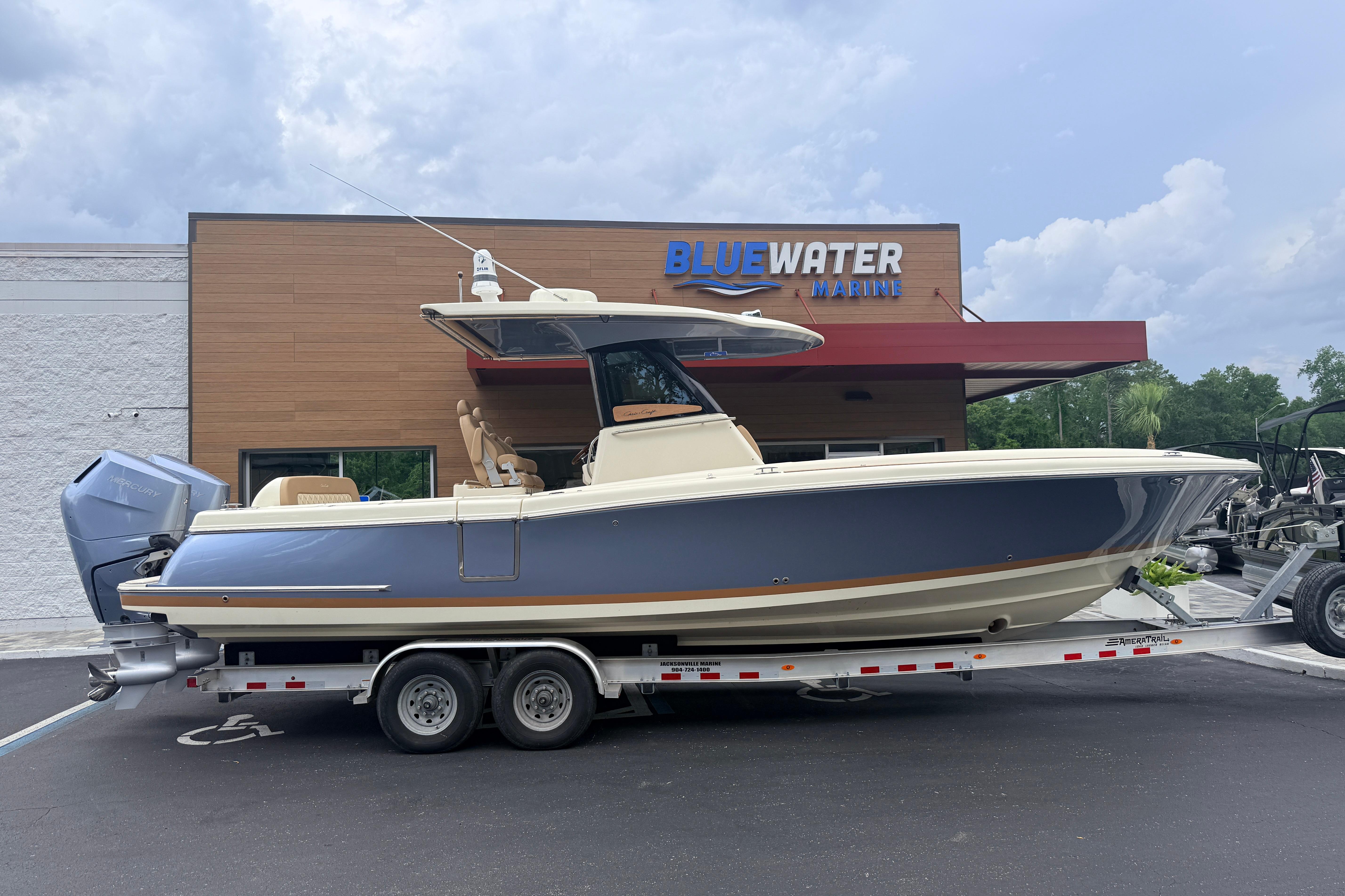 2024 Chris-Craft Catalina 30 boat on trailer at Bluewater Marine dealership.