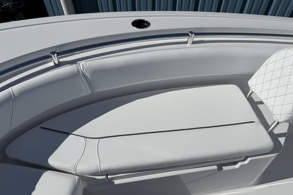 2026 Sportsman Open 232 Center Console boat with white cushioned seating.