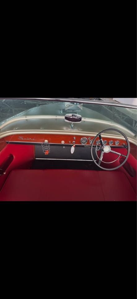 Interior of a 1965 Century Sabre with red leather and classic dashboard.