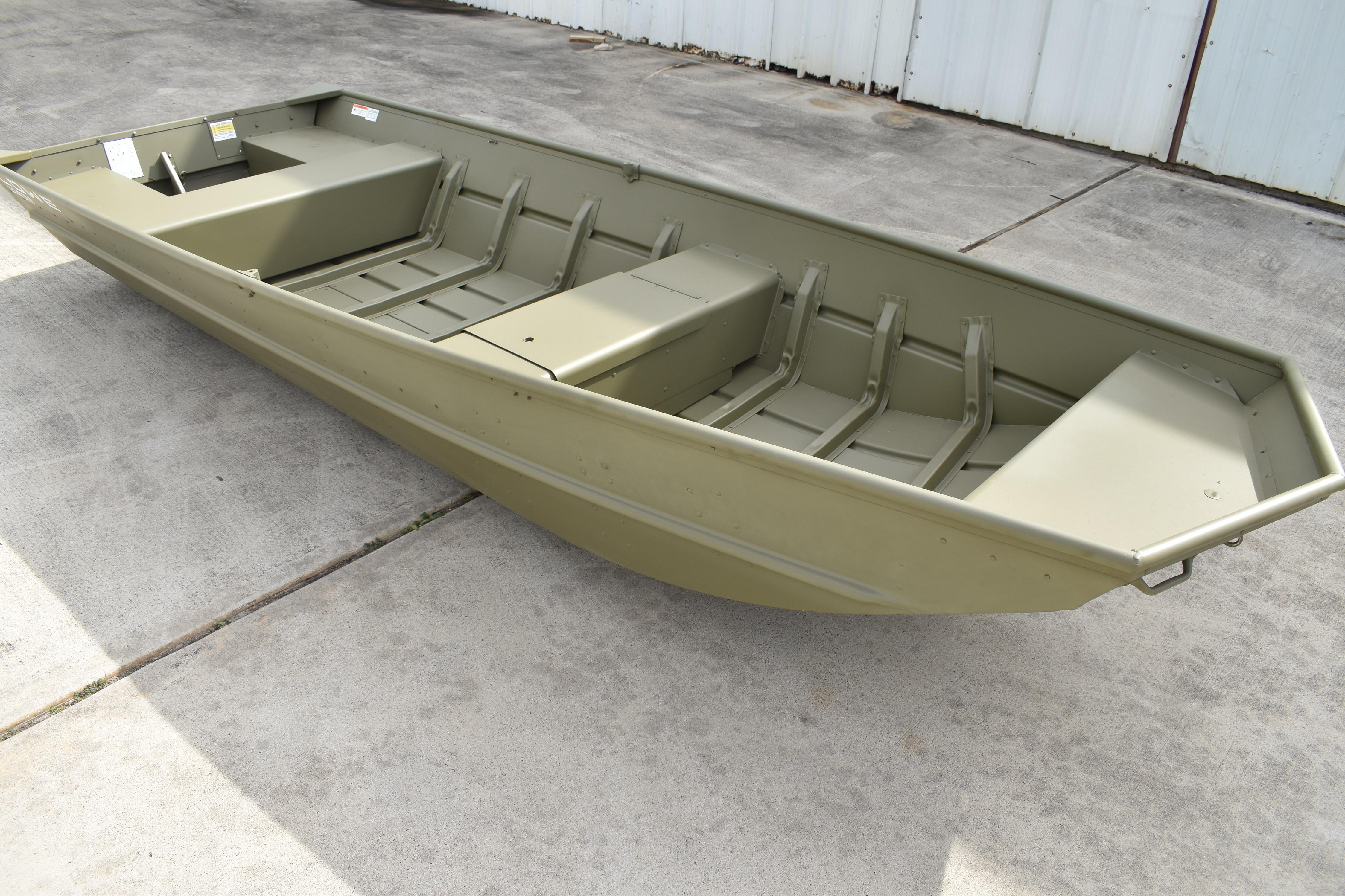 2024 Lowe L1440M Jon boat on concrete surface, showcasing its durable design.