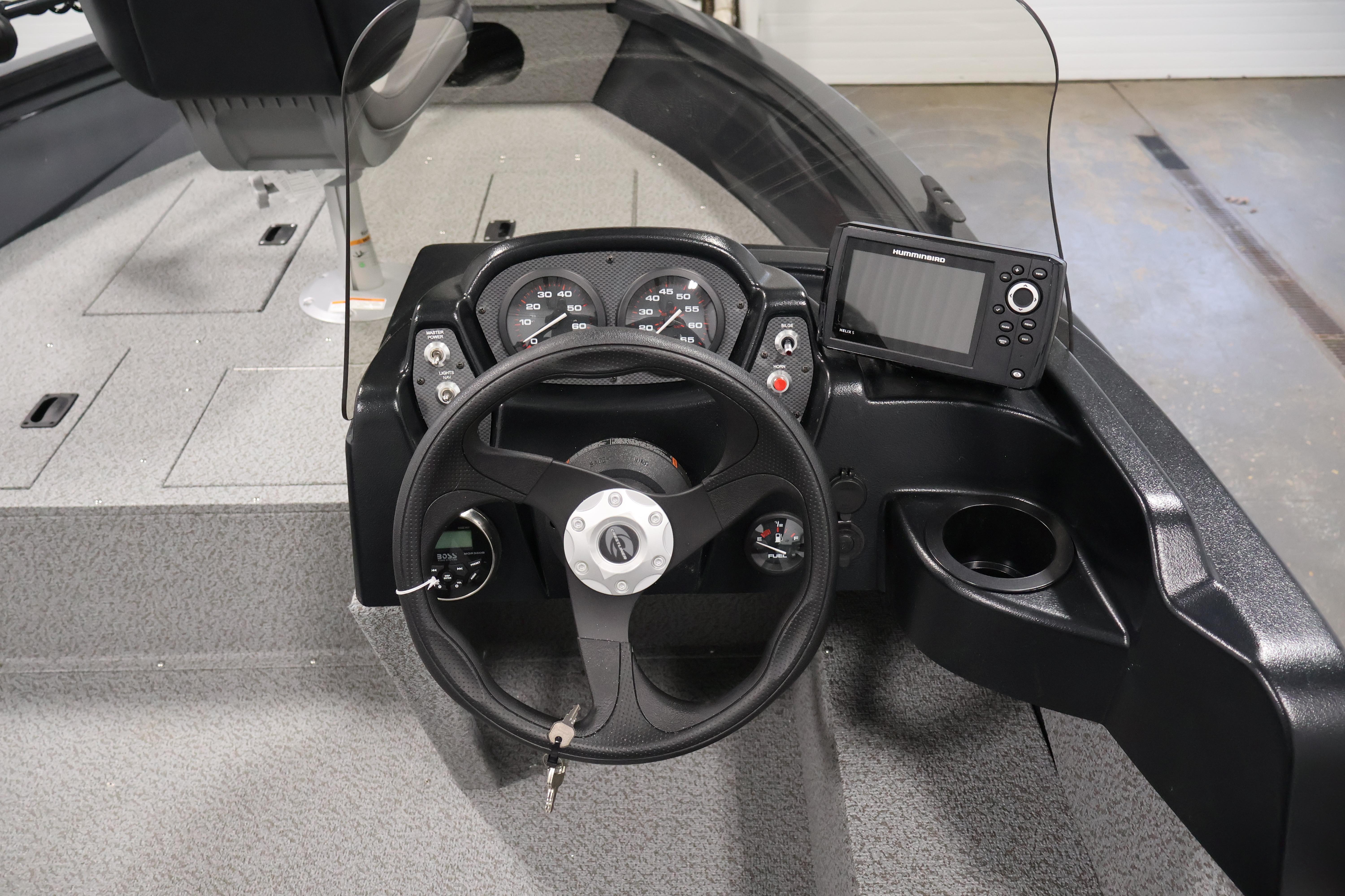 2026 Crestliner 1850 Kodiak SC boat dashboard with steering wheel and navigation system.