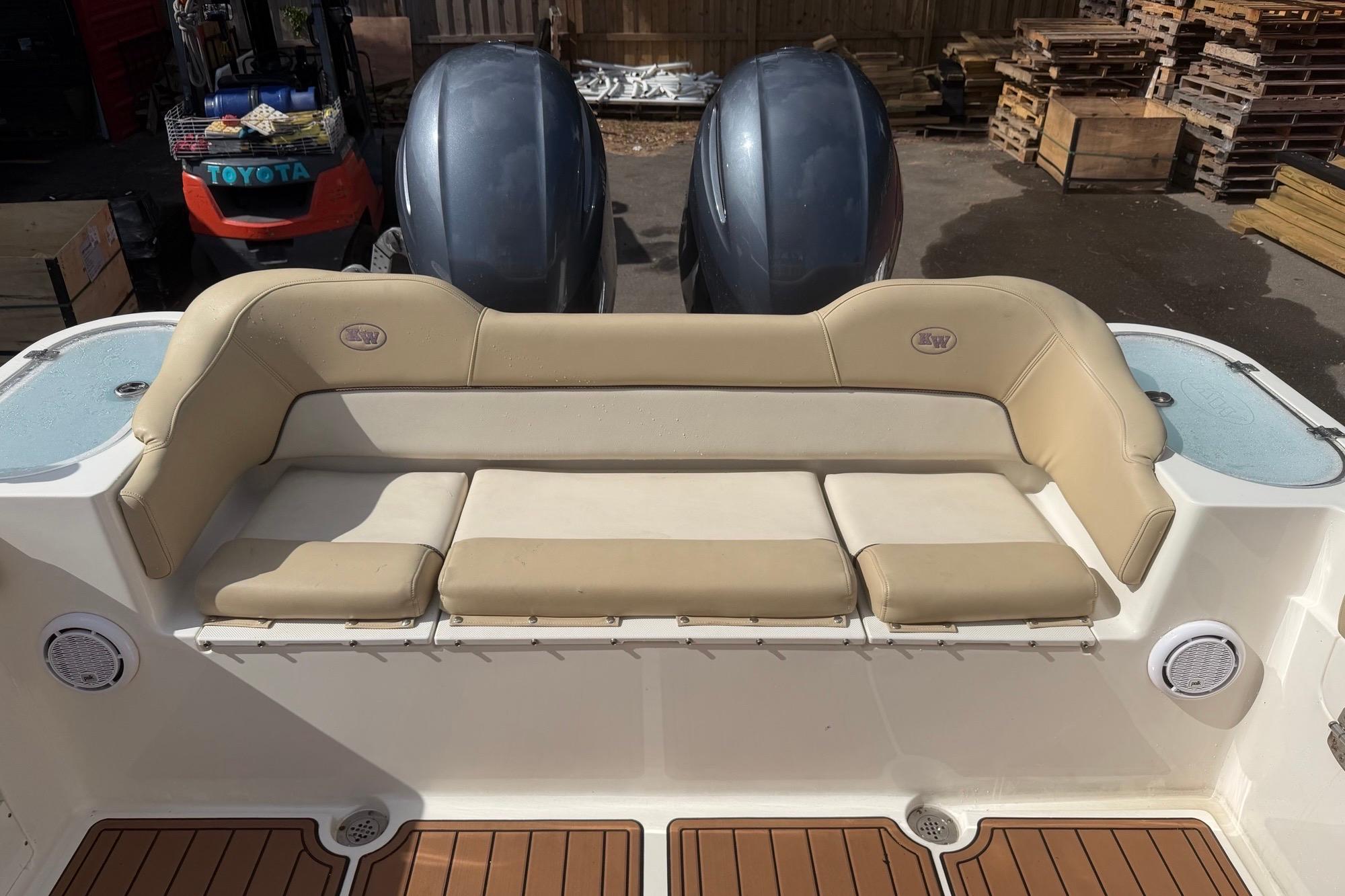 2019 Key West 263 FS boat with beige seating and twin engines.