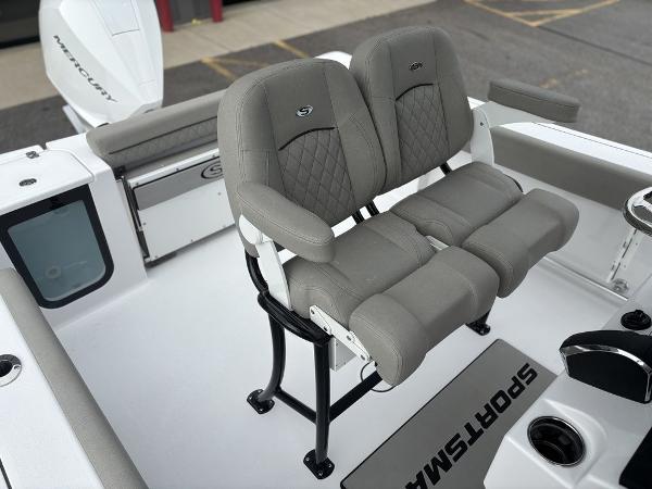 2025 Sportsman Open 232 boat with dual gray seats and Mercury engine.