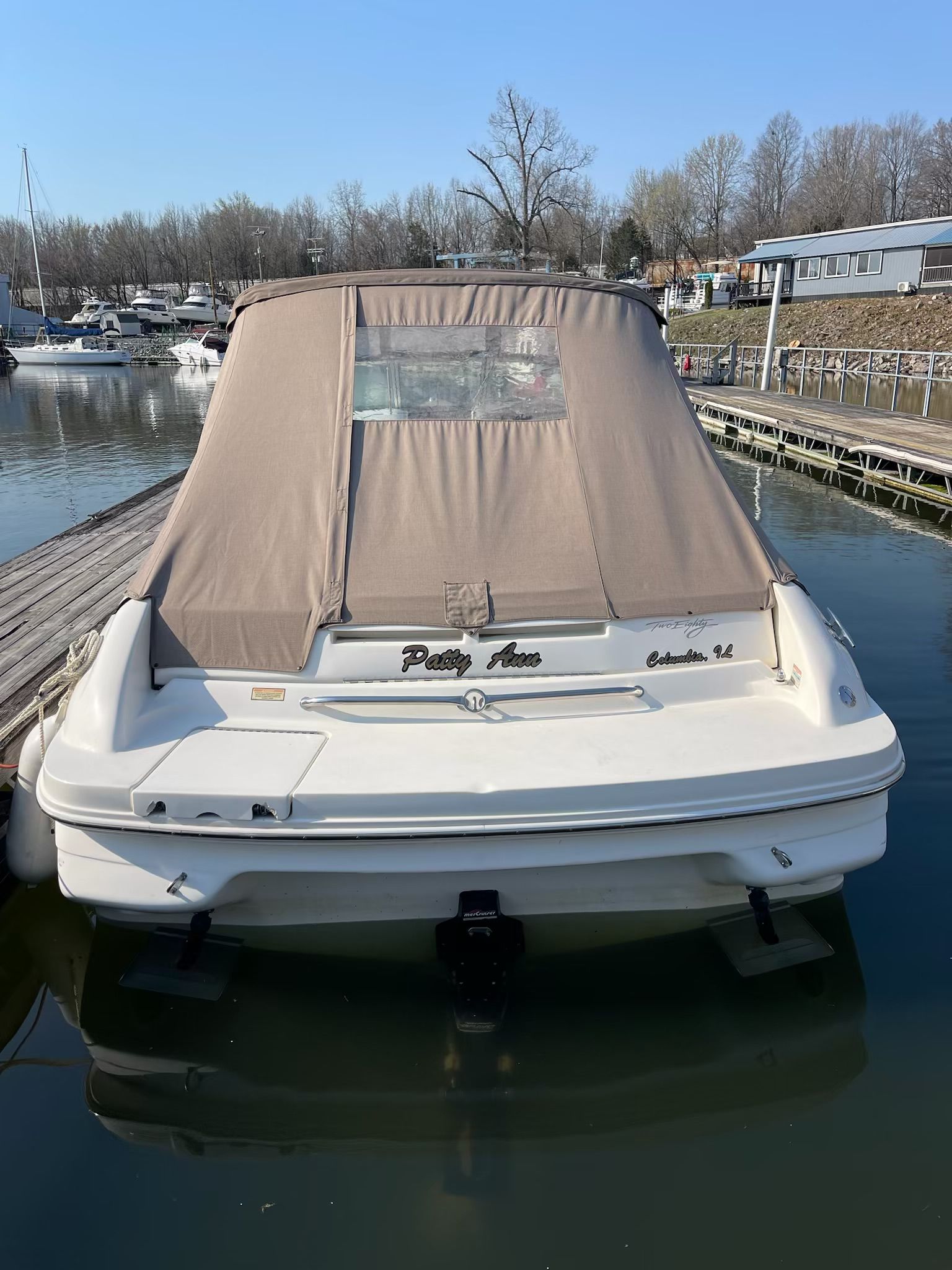 1998 Sea Ray 280 Bow Rider docked at marina.