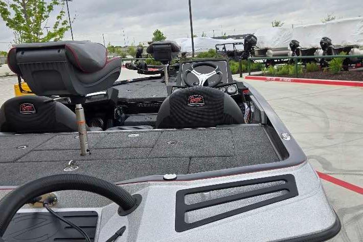 2025 Ranger Z518 boat interior with seating and steering wheel, parked outdoors.