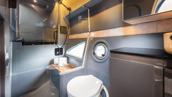 Modern bathroom interior in Hanover 415 RV, 2025 model, featuring sleek design and compact amenities.