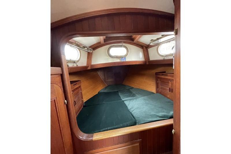 Interior cabin of 1980 Ta Shing Baba 30 sailboat with wooden finish.