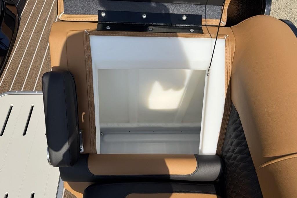 Open storage compartment on 2026 Premier 250 Solaris RS CL boat seat.