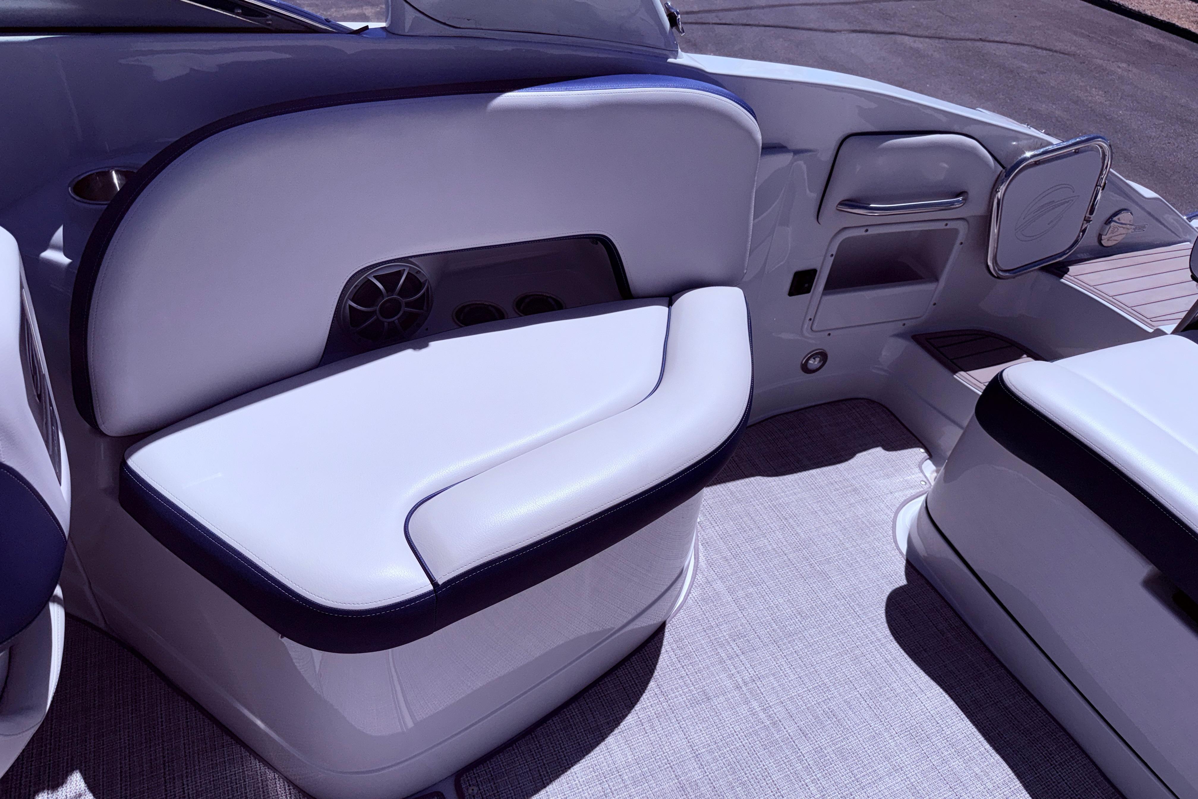 Interior seating of 2025 Crownline 290 XSS boat, featuring sleek white upholstery.