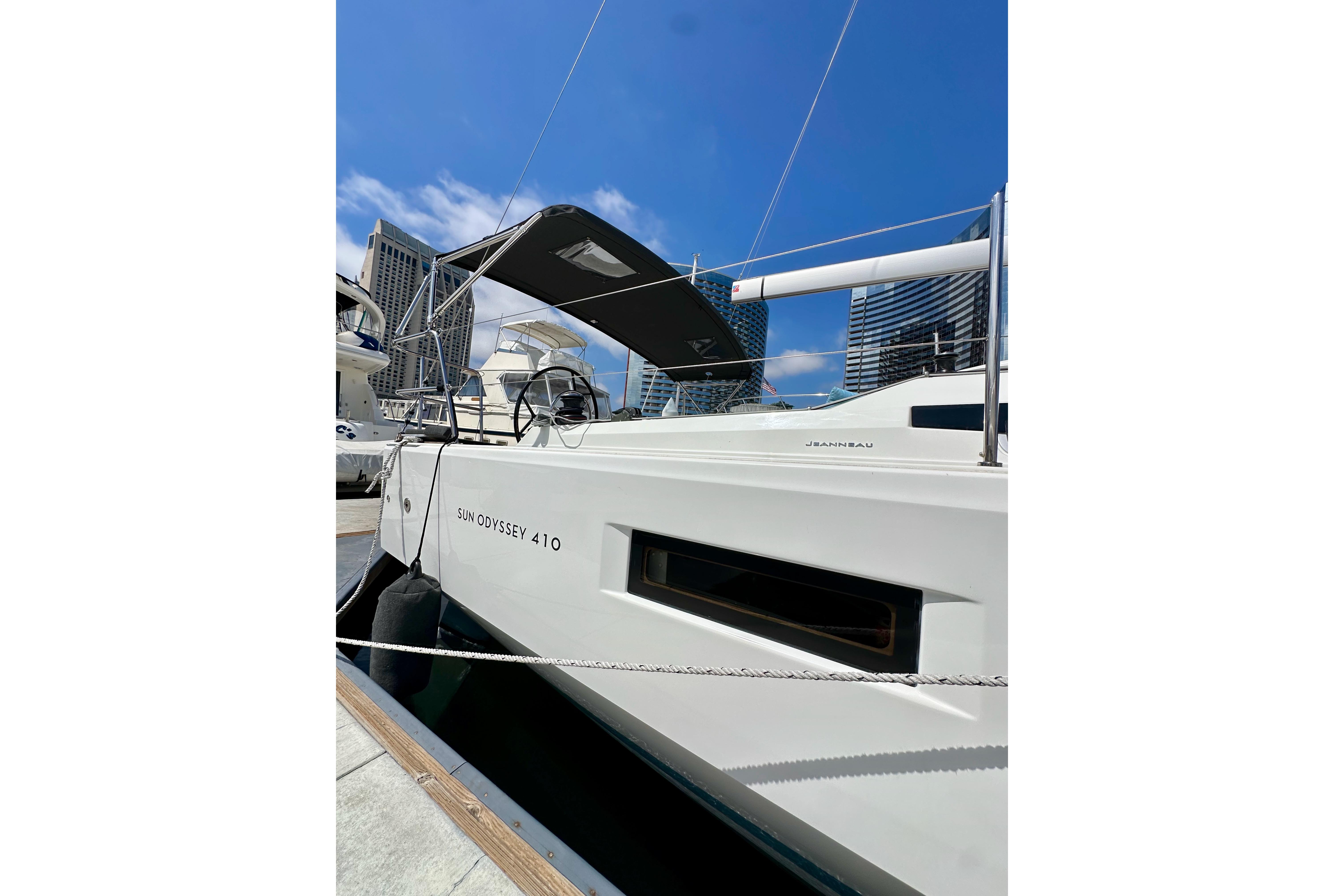 2024 Jeanneau Sun Odyssey 410 sailboat docked under clear blue sky.