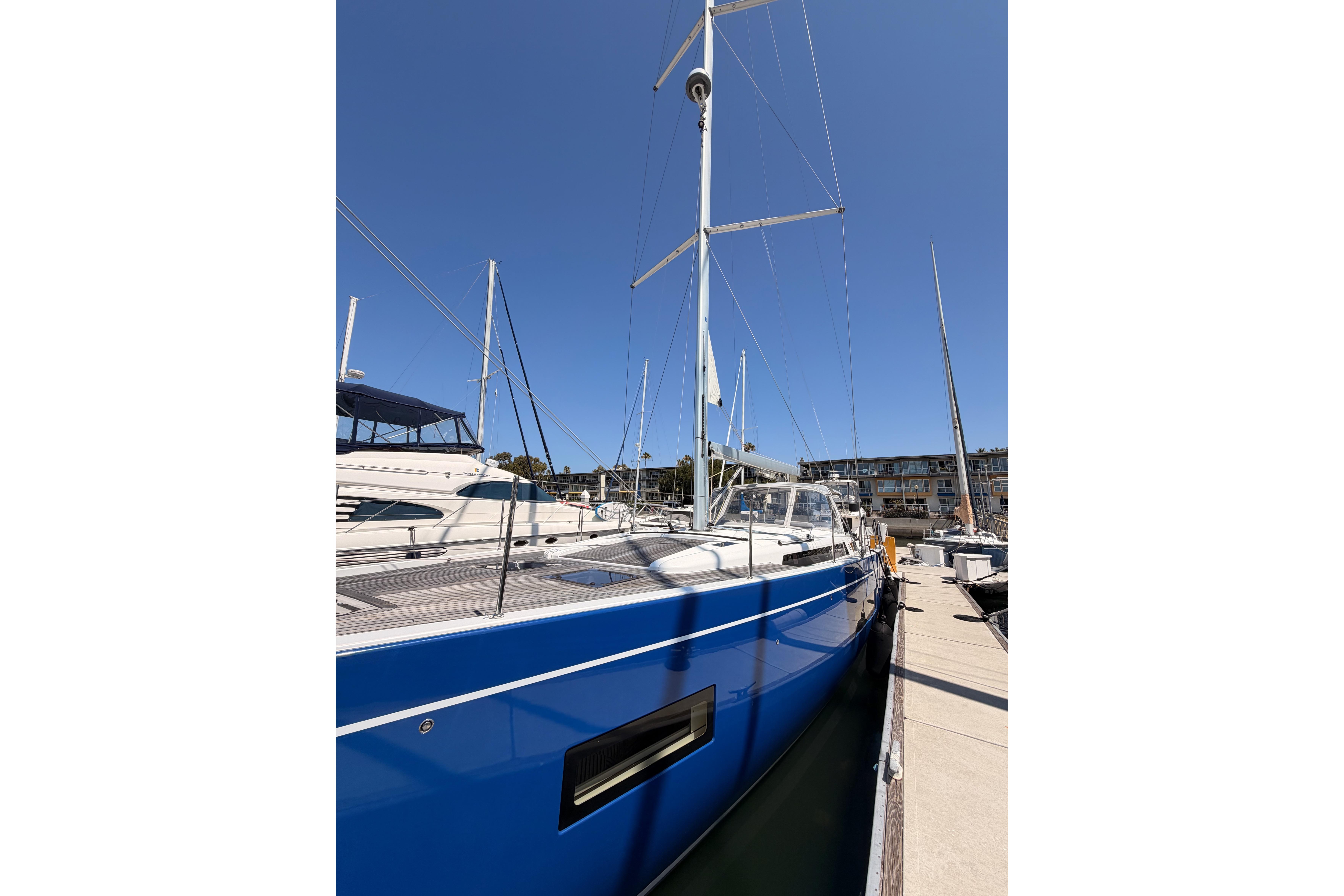 2022 Beneteau Oceanis Yacht 54 docked, showcasing sleek blue hull and modern design.