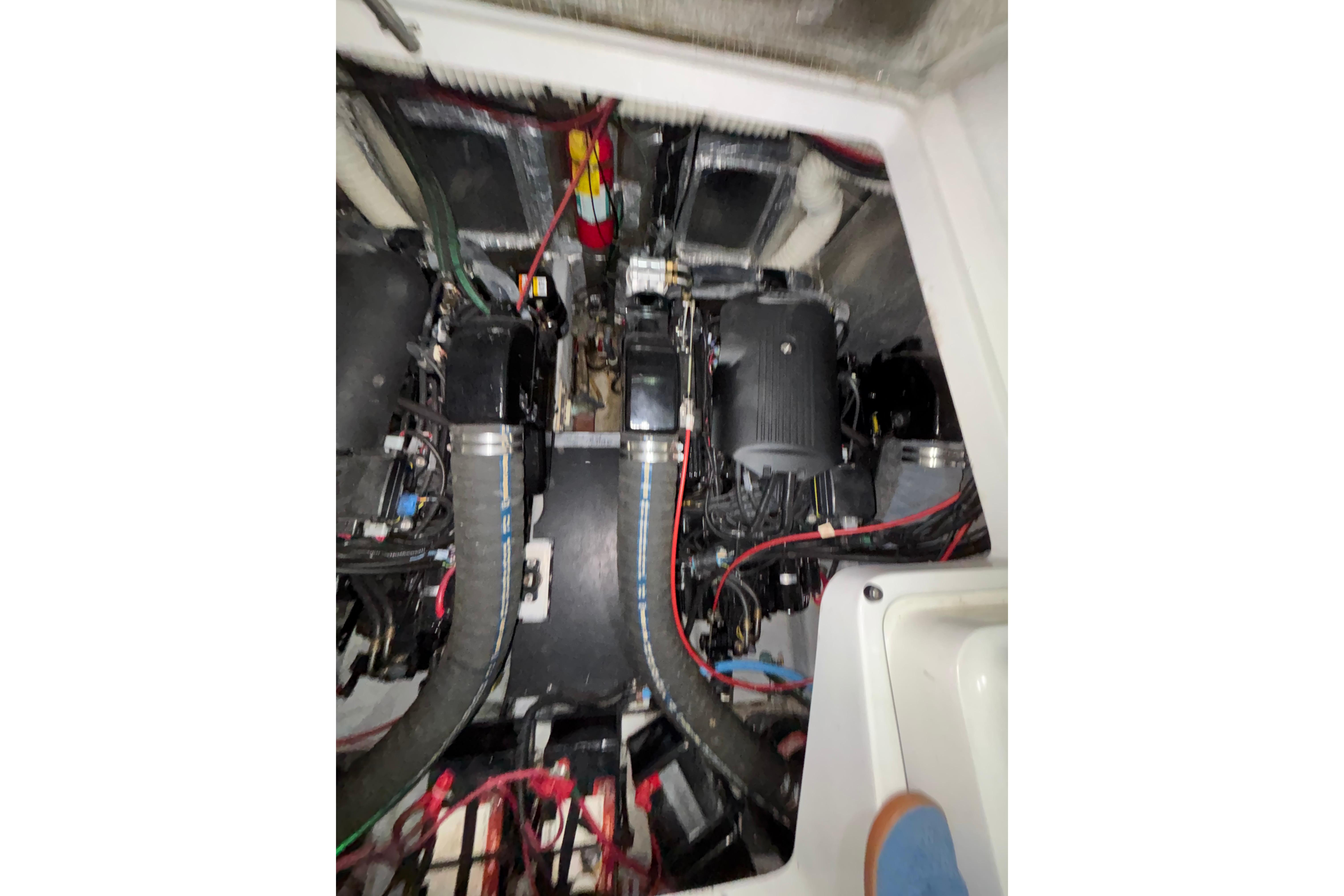 Engine compartment of a 1995 Luhrs 29 Open boat, showcasing mechanical components.
