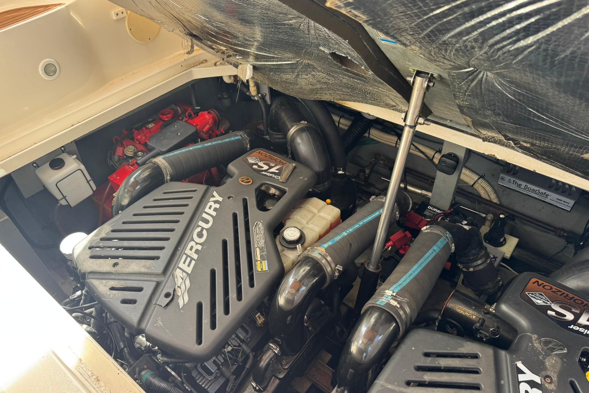Engine compartment of a 2001 Sea Ray 340 Sundancer with Mercury 5.7L engines.
