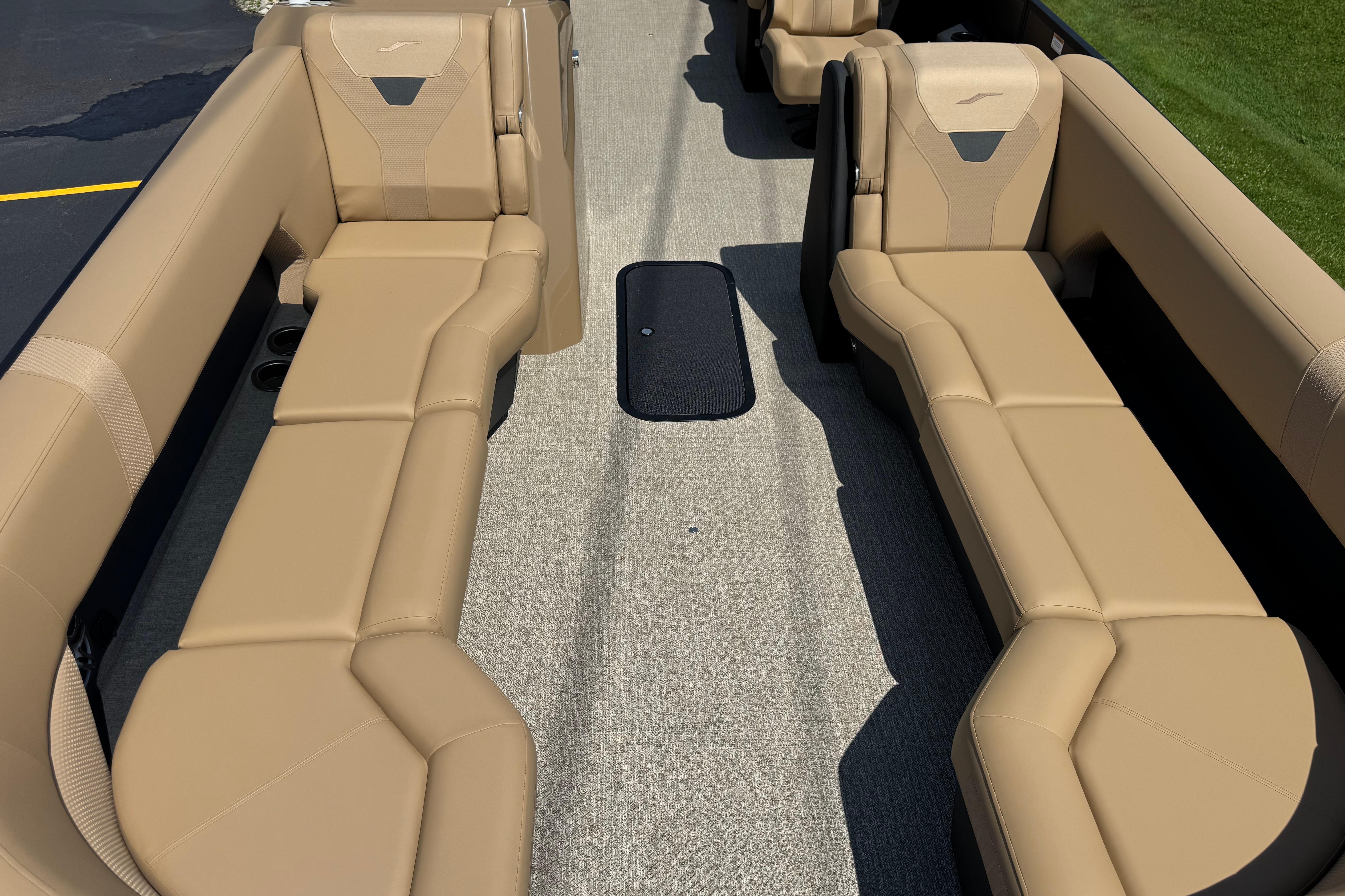 Luxurious beige seating on 2026 Evotti 525QL boat, showcasing spacious interior design.